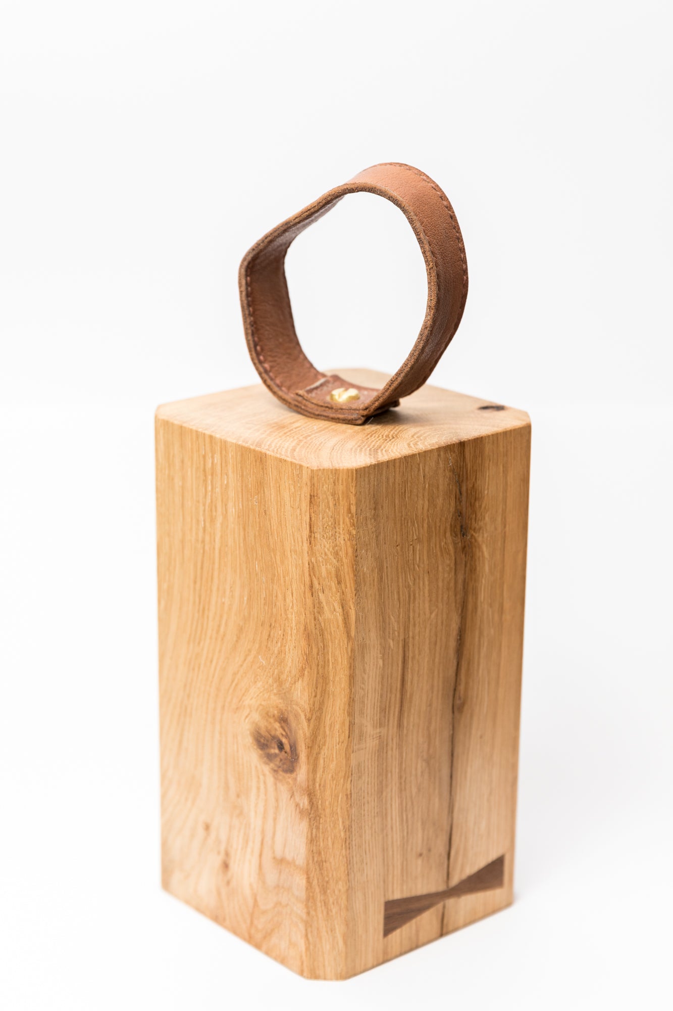 Door stop with reclaimed walnut inlay and handmade leather handle