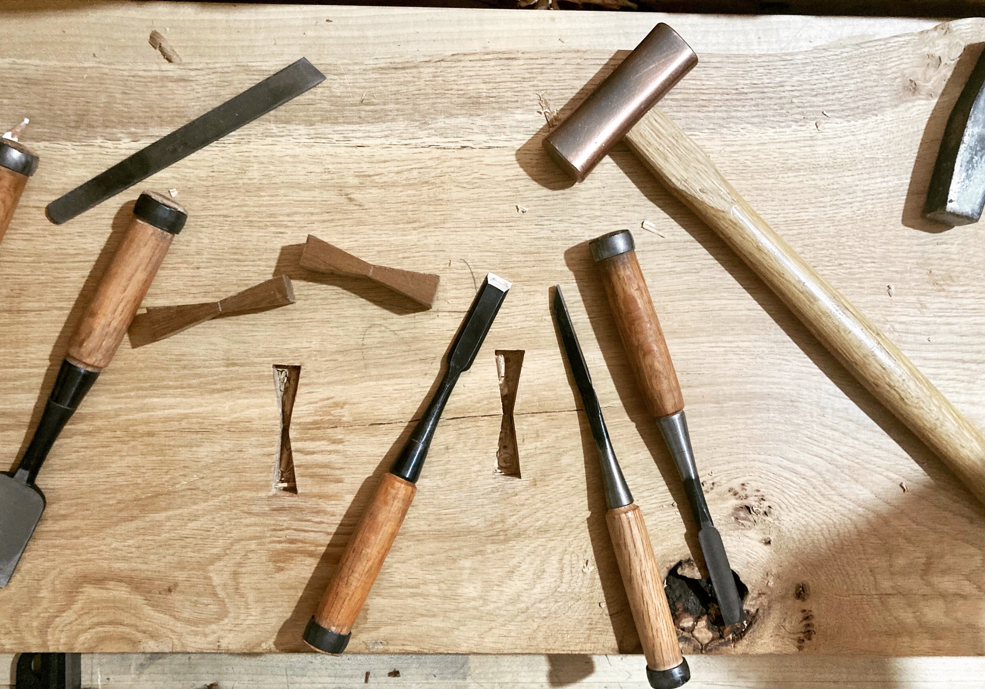 Hand tools used in my handmade furniture. Fitting butterfly inlay into a split in a live edge oak bench