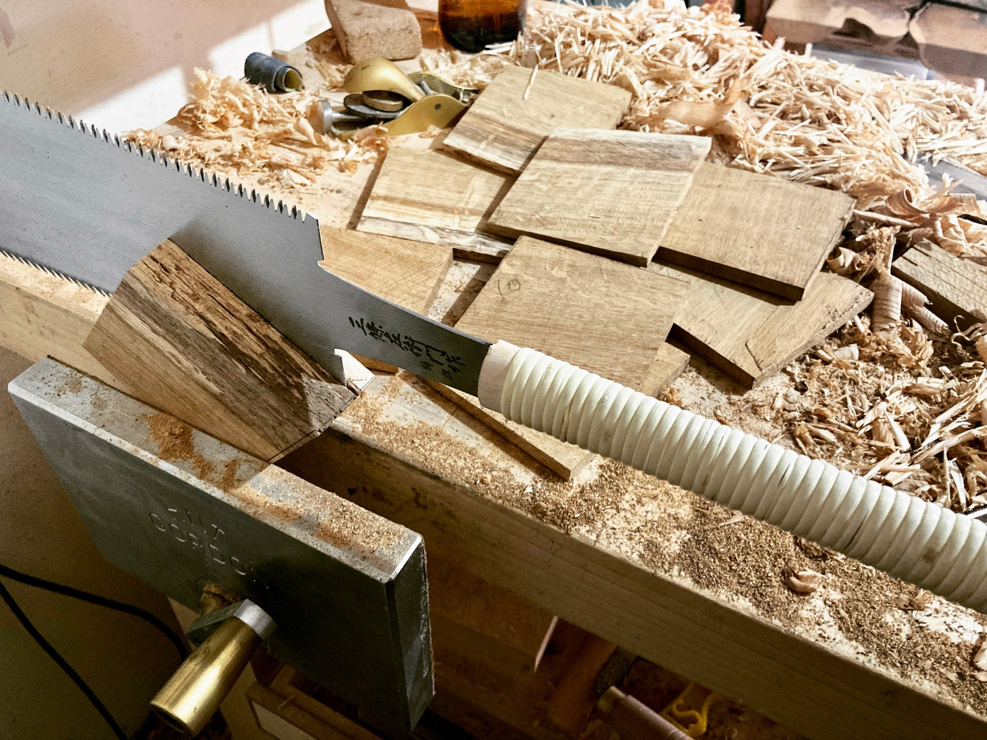 Hand sawing a piece of oak into coasters